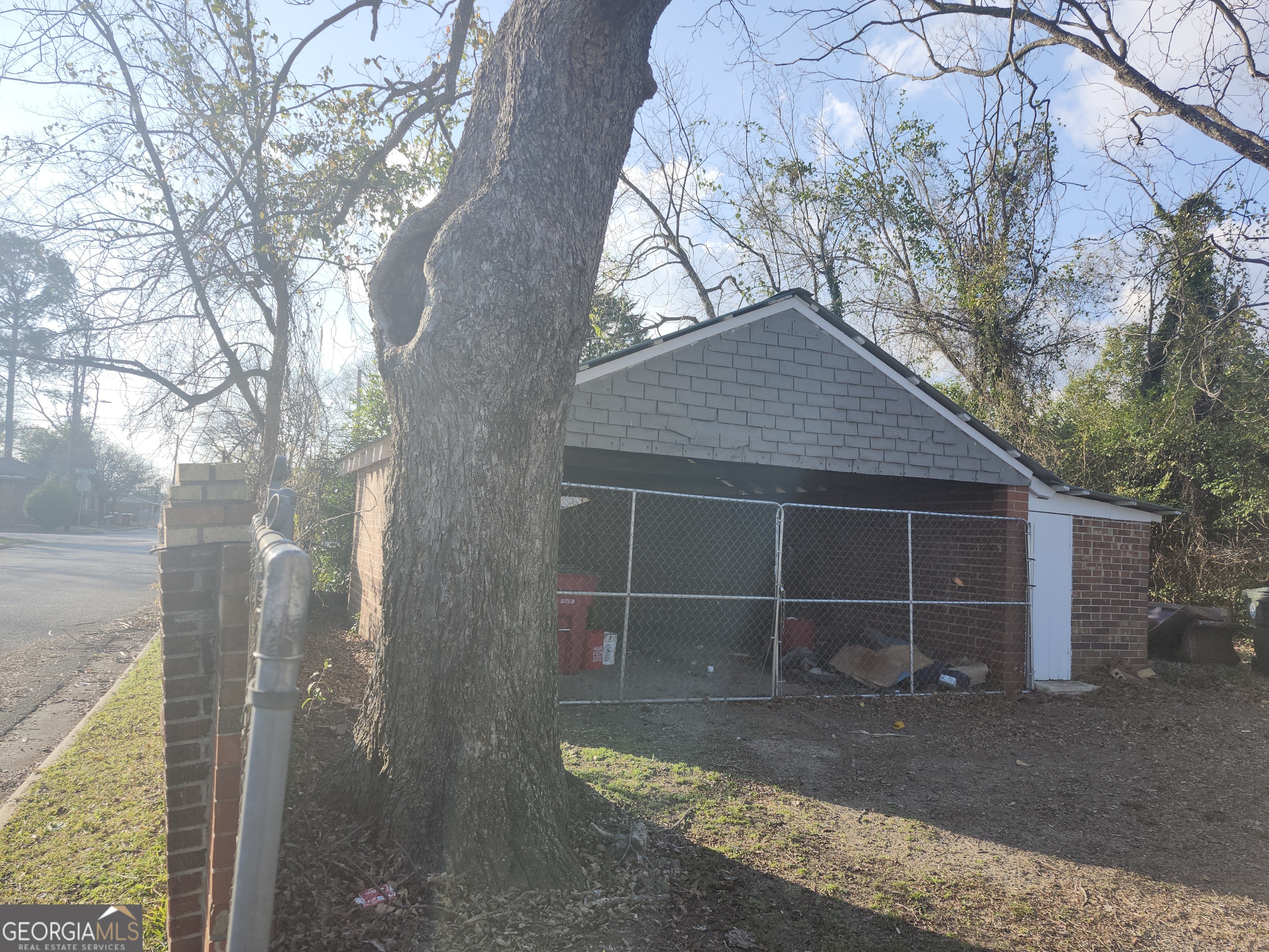 1121 Carroll Street Macon, GA 31206 - Photo 10 of 10 a front view of a house with a yard and garage