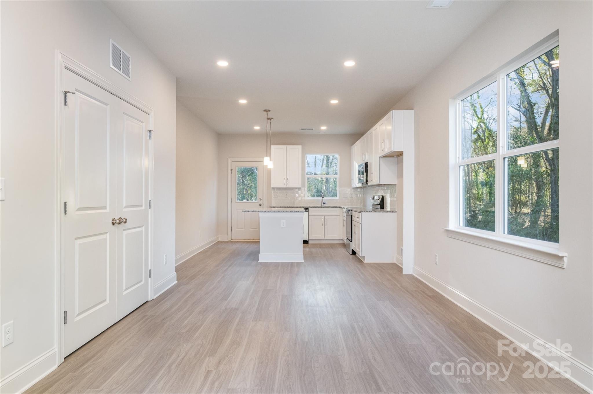 203 William Street York, SC 29745 - Photo 4 of 17 a view of a kitchen with wooden floor and windows