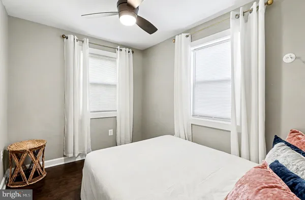 a bedroom with a bed and a chair