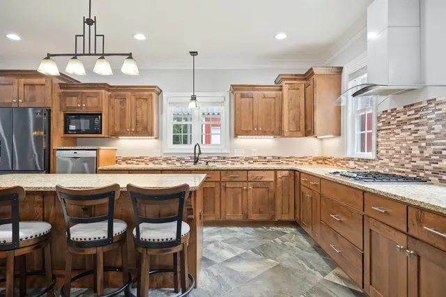 a kitchen with a refrigerator and a sink