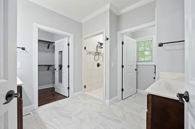 a view of entryway and hall with wooden floor