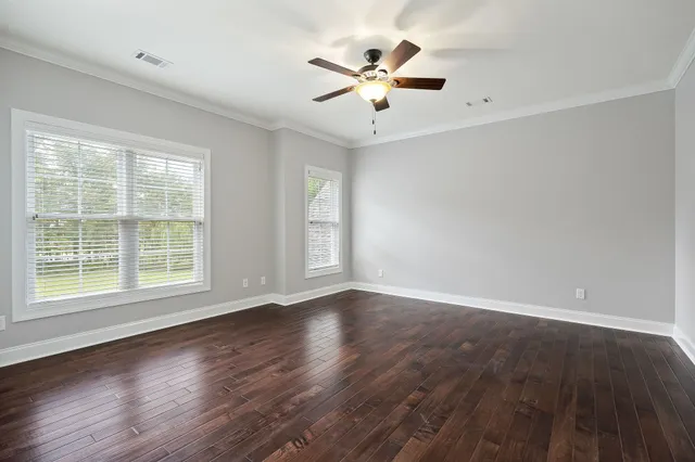 a view of a house with a backyard and garage