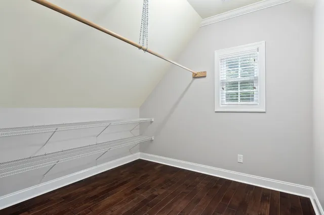 a view of an empty room with wooden walls