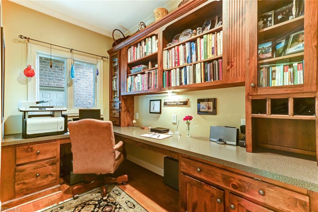 6310 Hunt Road Pleasant Garden, NC 27313 - Photo 12 of 30 Command Central! Custom cabinetry and bookcases provide an efficient way to organize estate business. Privately situated along the rear service hall leading the "poolside" half bath, and three car garage.