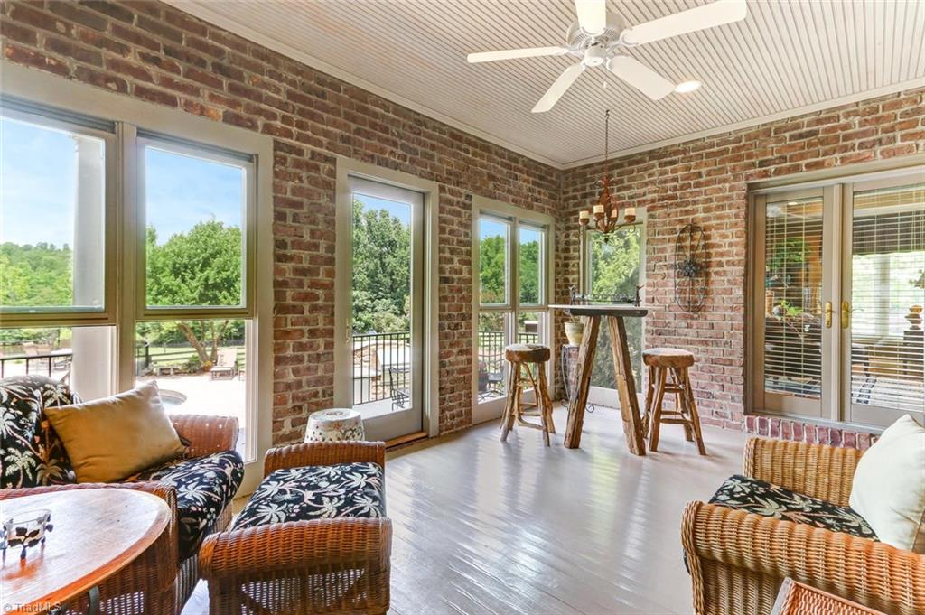 6310 Hunt Road Pleasant Garden, NC 27313 - Photo 15 of 30 The second sunroom adjoins the study and is more informal for lounging around. This room would make an incredible office with spectacular views of horses grazing lakeside.