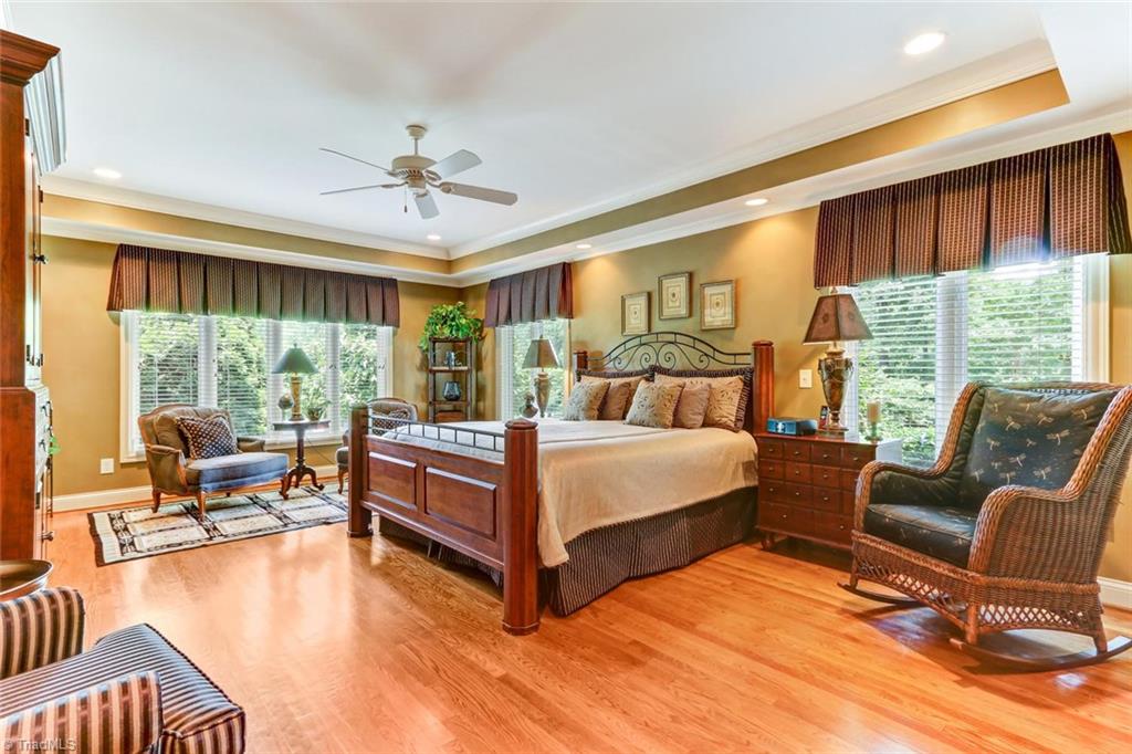 6310 Hunt Road Pleasant Garden, NC 27313 - Photo 16 of 30 The master retreat! Overlooking everything without overlooking anything. Located on the main level but nestled away on the rear corner you can relax while enjoying the pastoral views. Immaculate neutral dcor throughout.