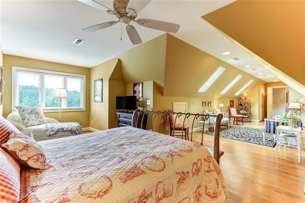 6310 Hunt Road Pleasant Garden, NC 27313 - Photo 21 of 30 The gallery and bonus room open to a second retreat! Perfect for your guest needing get-away space! Large and roomy, large closet and bath. Great place for breakfast in bed!