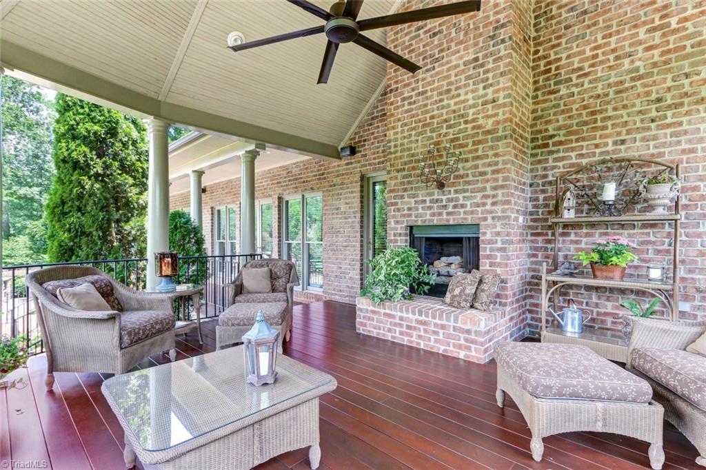 6310 Hunt Road Pleasant Garden, NC 27313 - Photo 5 of 30 The covered rear porch is one of many places to rest and relax. Enjoy music from the integrated sound system. Complete with a gas fireplace to keep off the chill of spring and fall evenings . Beadboard gazebo style ceiling with fan and recessed lighting.