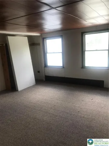 a bathroom with a sink mirror vanity and toilet