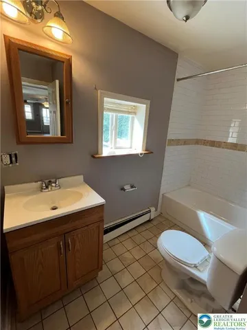 a view of an empty room with a closet