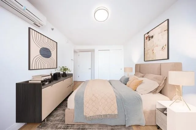 a bedroom with a bed and a cabinets