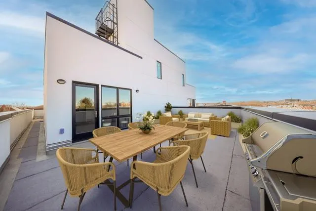a view of a table and chairs in patio of the house