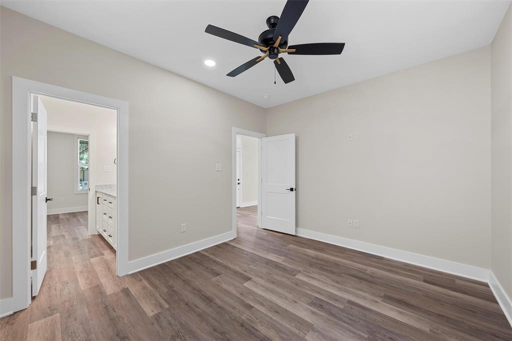 2923 Reuter Avenue Waco, TX 76708 - Photo 15 of 34 an empty room with wooden floor and a ceiling fan