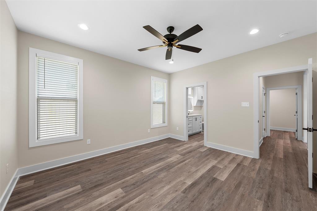 2923 Reuter Avenue Waco, TX 76708 - Photo 20 of 34 a view of a big room with wooden floor and windows