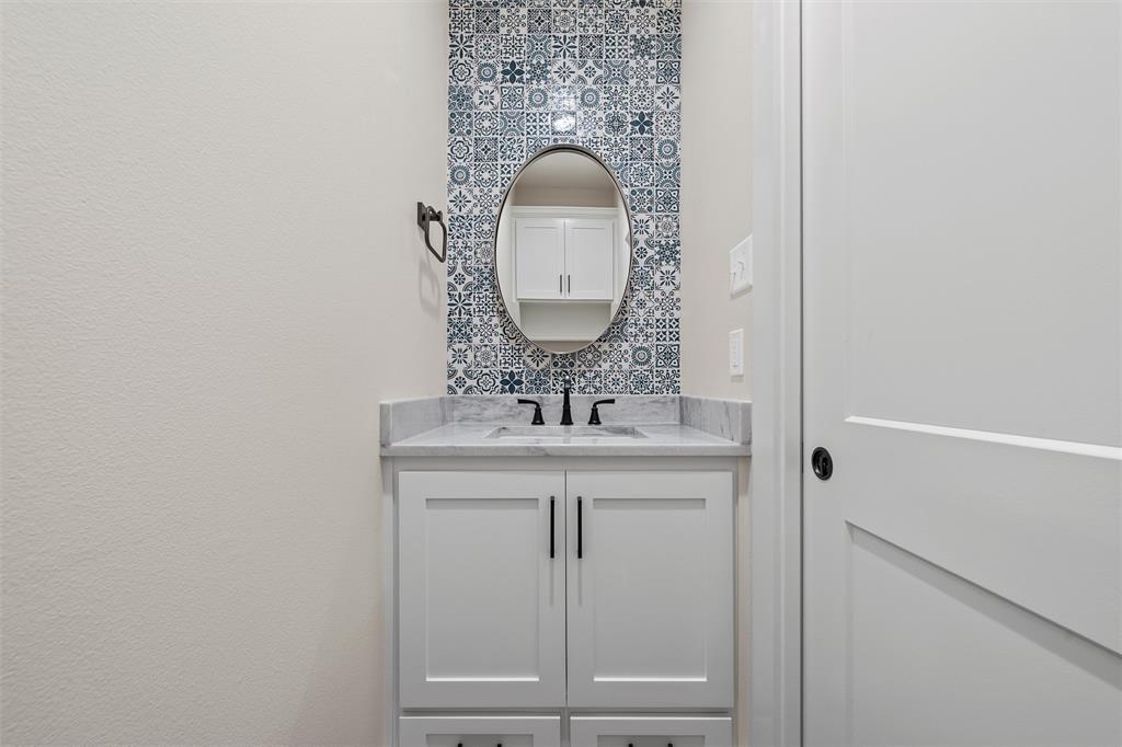 2923 Reuter Avenue Waco, TX 76708 - Photo 24 of 34 a bathroom with a sink and a mirror