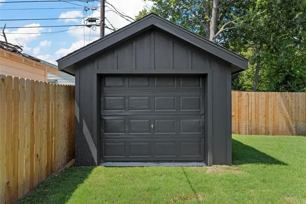 a wooden house with a small yard