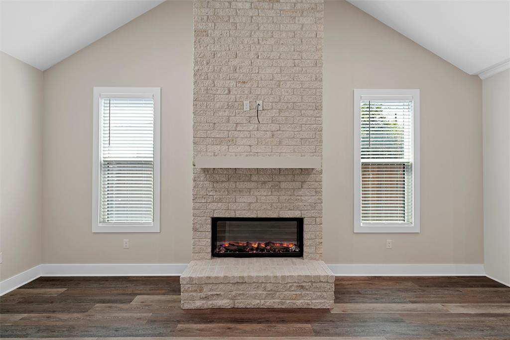 2923 Reuter Avenue Waco, TX 76708 - Photo 7 of 34 a view of an empty room with wooden floor and a window