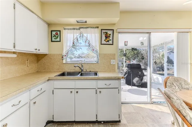 a kitchen with a refrigerator a stove a sink and a refrigerator