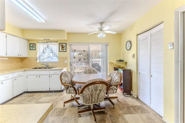 a view of a dining room with furniture and a window