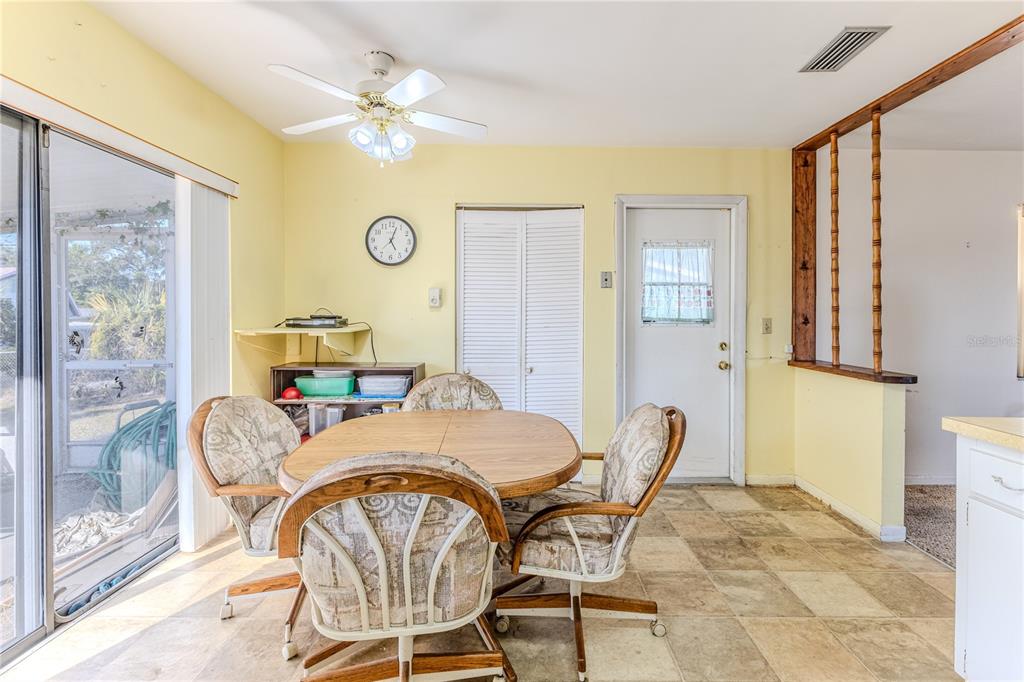6352 Spring Hill Drive Spring Hill, FL 34606 - Photo 15 of 35 a view of a dining room with furniture and a window