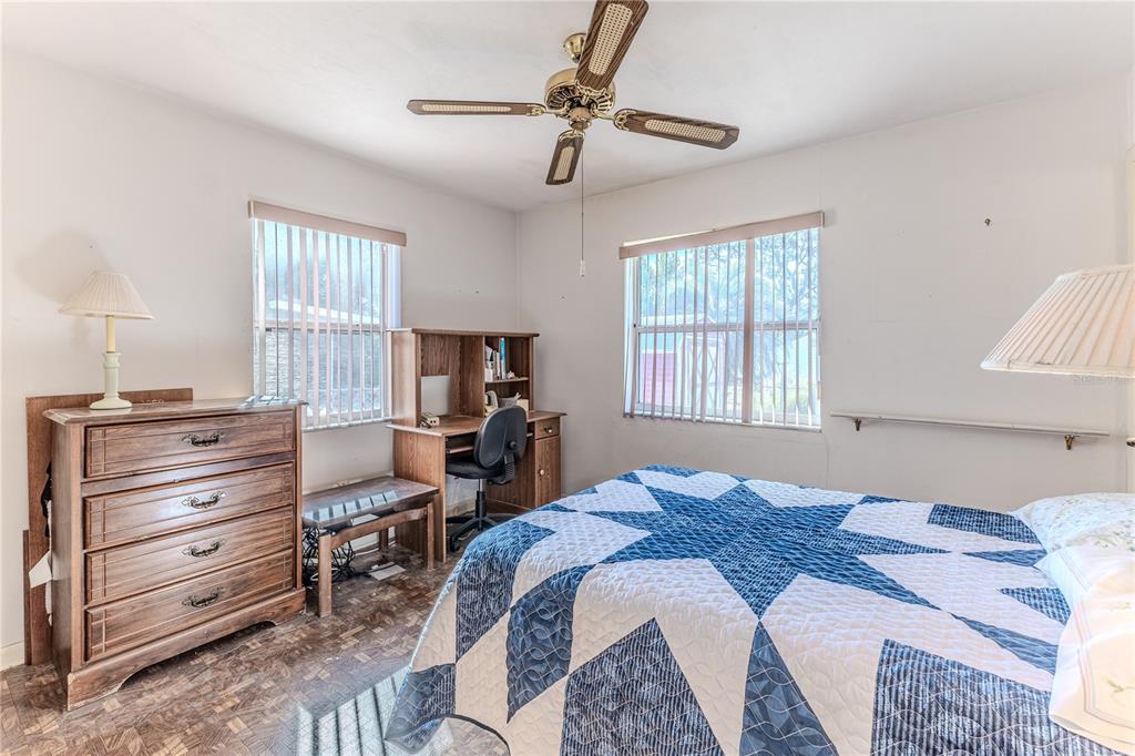 6352 Spring Hill Drive Spring Hill, FL 34606 - Photo 16 of 35 a bedroom with a bed and a window