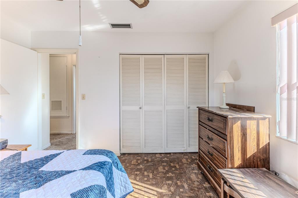 6352 Spring Hill Drive Spring Hill, FL 34606 - Photo 18 of 35 a bedroom with a bed and a window