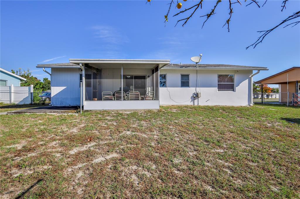 6352 Spring Hill Drive Spring Hill, FL 34606 - Photo 29 of 35 front view of a house with a yard