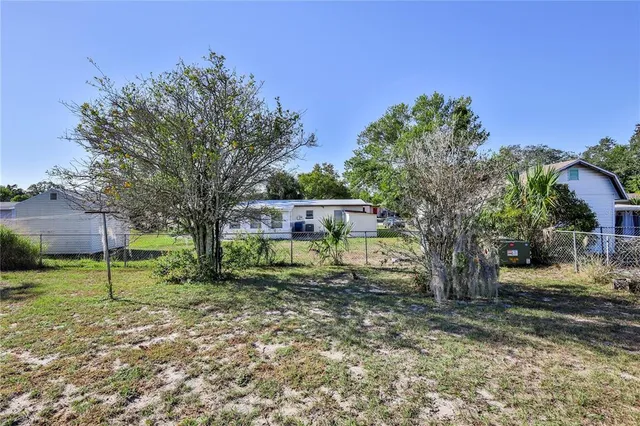 a view of house with a swimming pool