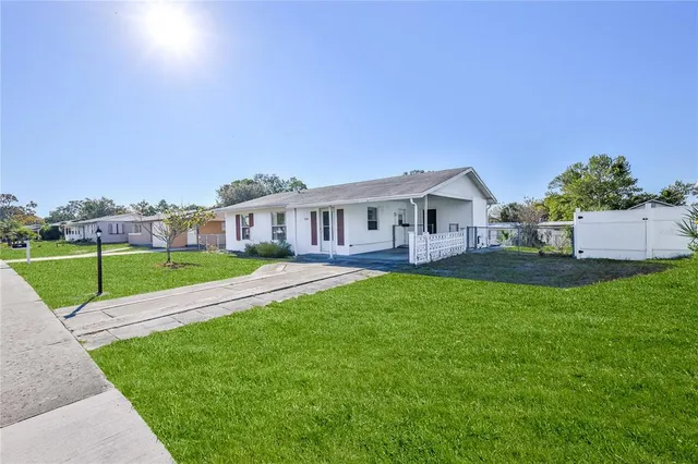 a living room with furniture a ceiling fan and a rug