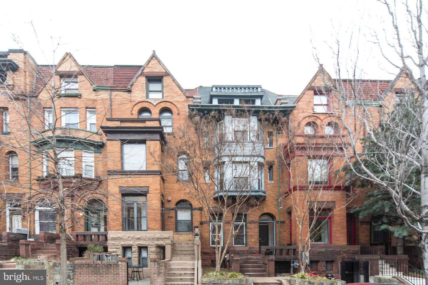 a view of a large building with a clock on the wall
