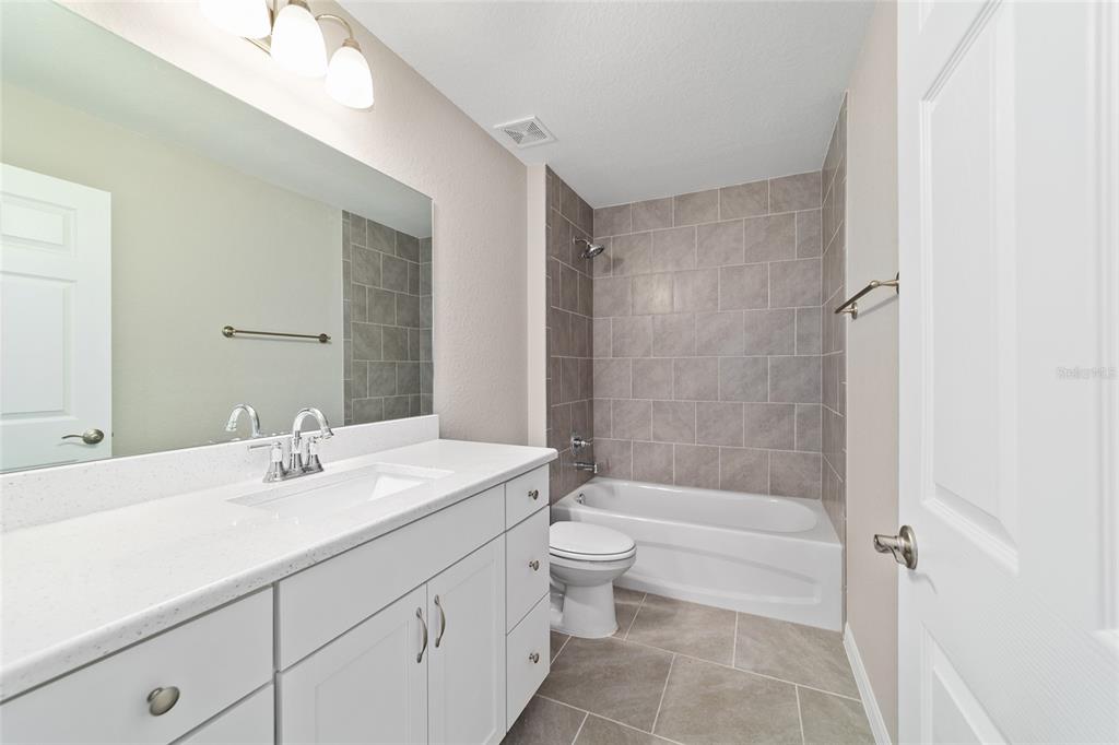 19231 Southwest 97th Street Dunnellon, FL 34432 - Photo 15 of 31 a bathroom with a sink a toilet and shower