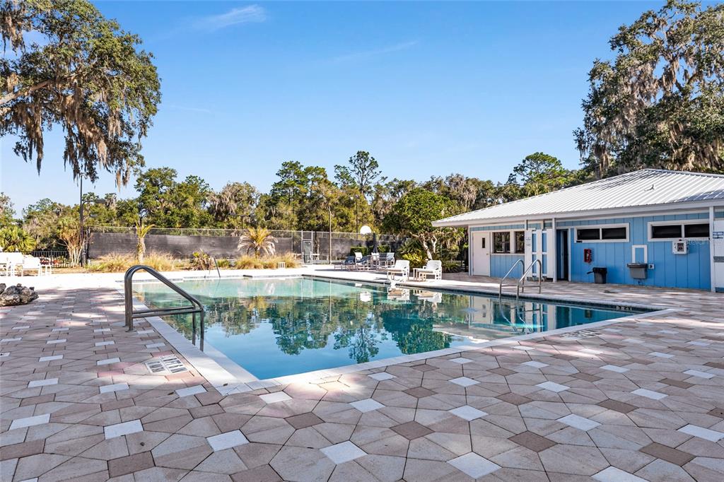 19231 Southwest 97th Street Dunnellon, FL 34432 - Photo 22 of 31 a view of a house with backyard and sitting area