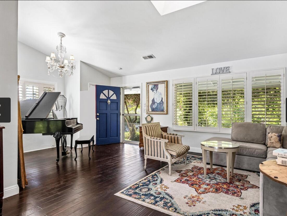 4156 Vista Clara Road Santa Barbara, CA 93110 - Photo 11 of 36 a living room with furniture and a floor to ceiling window