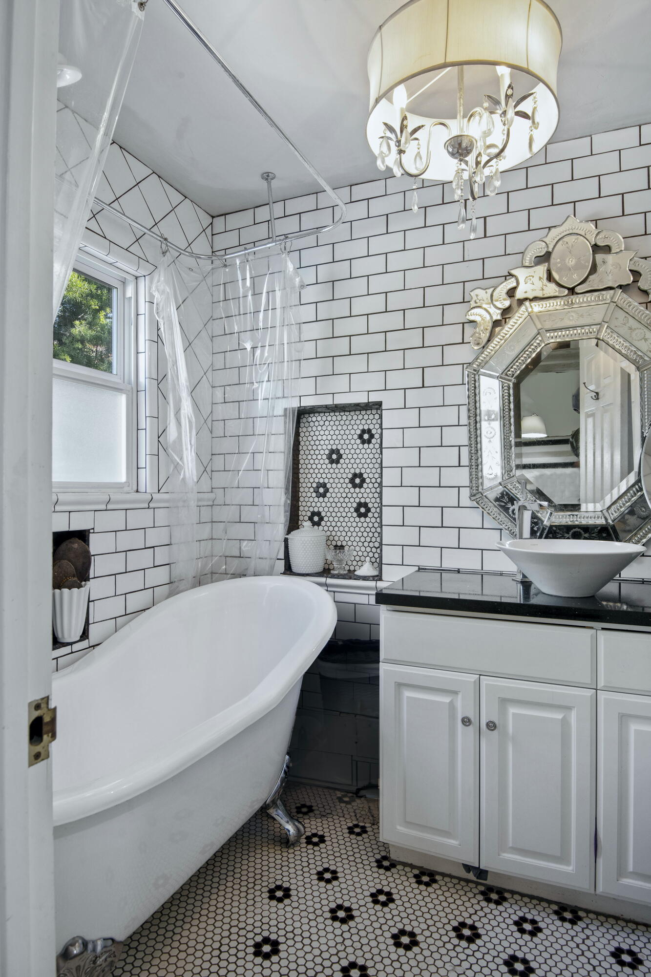 4156 Vista Clara Road Santa Barbara, CA 93110 - Photo 19 of 36 a bathroom with a sink a large mirror and a bathtub