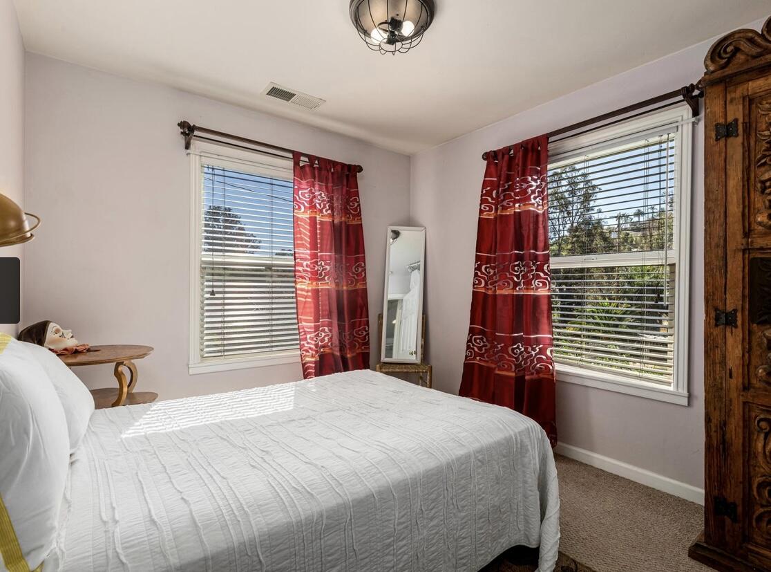 4156 Vista Clara Road Santa Barbara, CA 93110 - Photo 29 of 36 a bedroom with a bed and a window