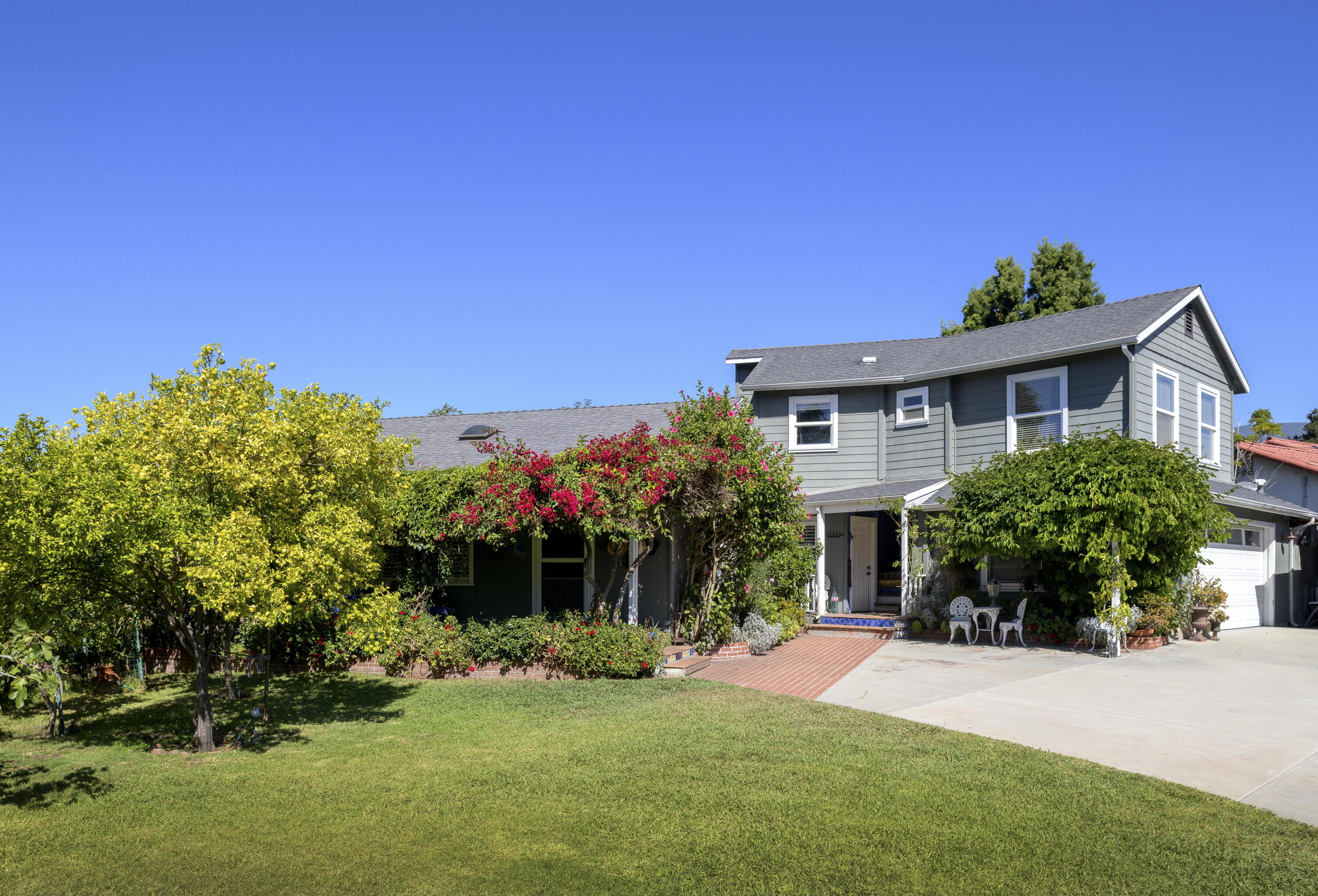4156 Vista Clara Road Santa Barbara, CA 93110 - Photo 8 of 36 a front view of a house with a yard