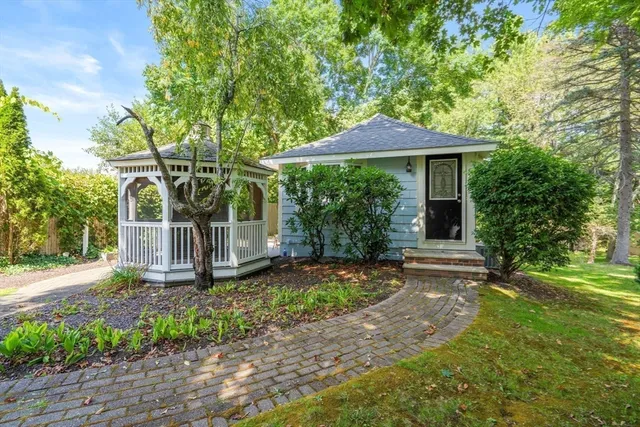 a front view of a house with garden