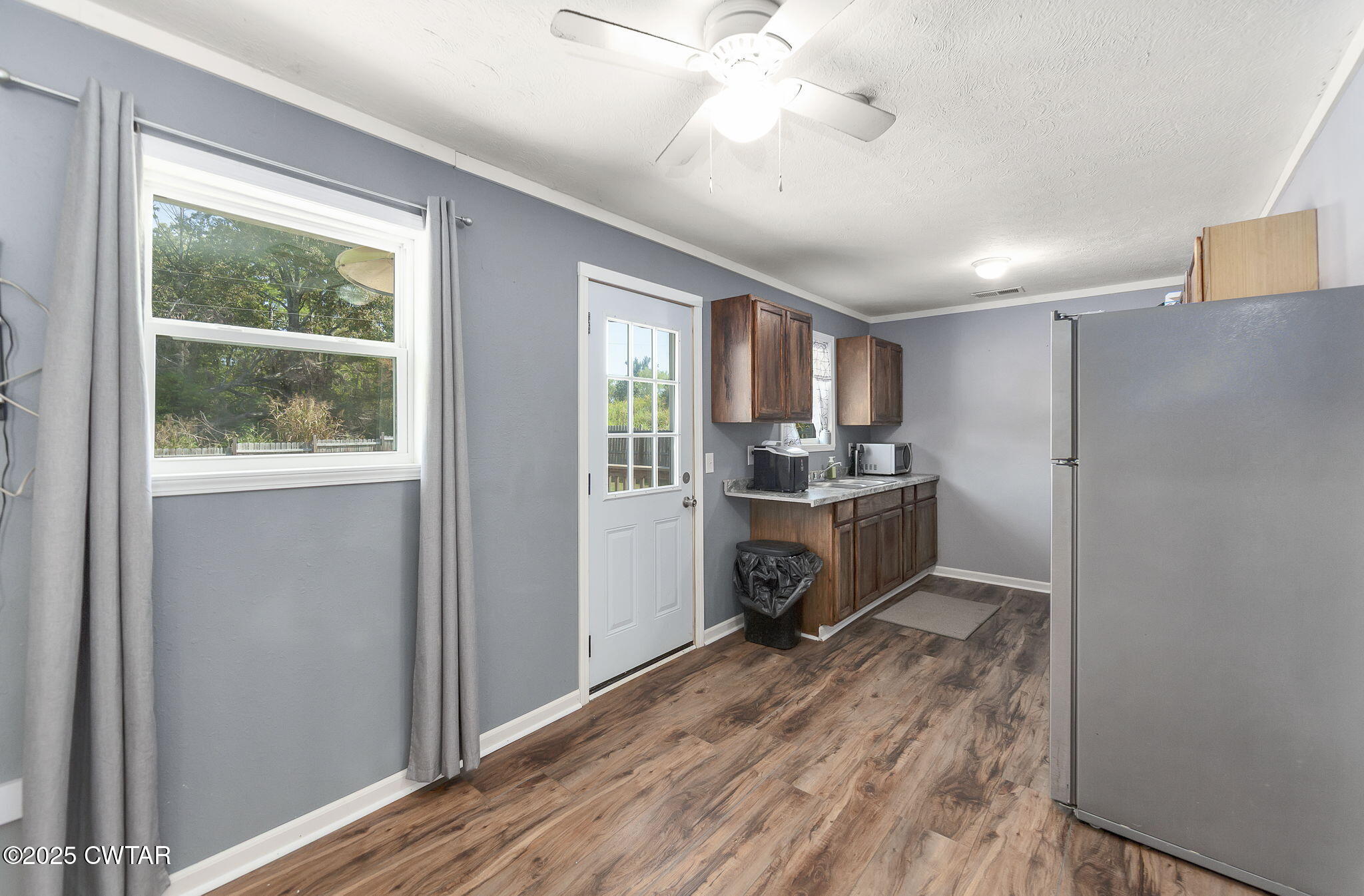 668 Bowman Road Medon, TN 38356 - Photo 12 of 24 a kitchen with a refrigerator and a sink