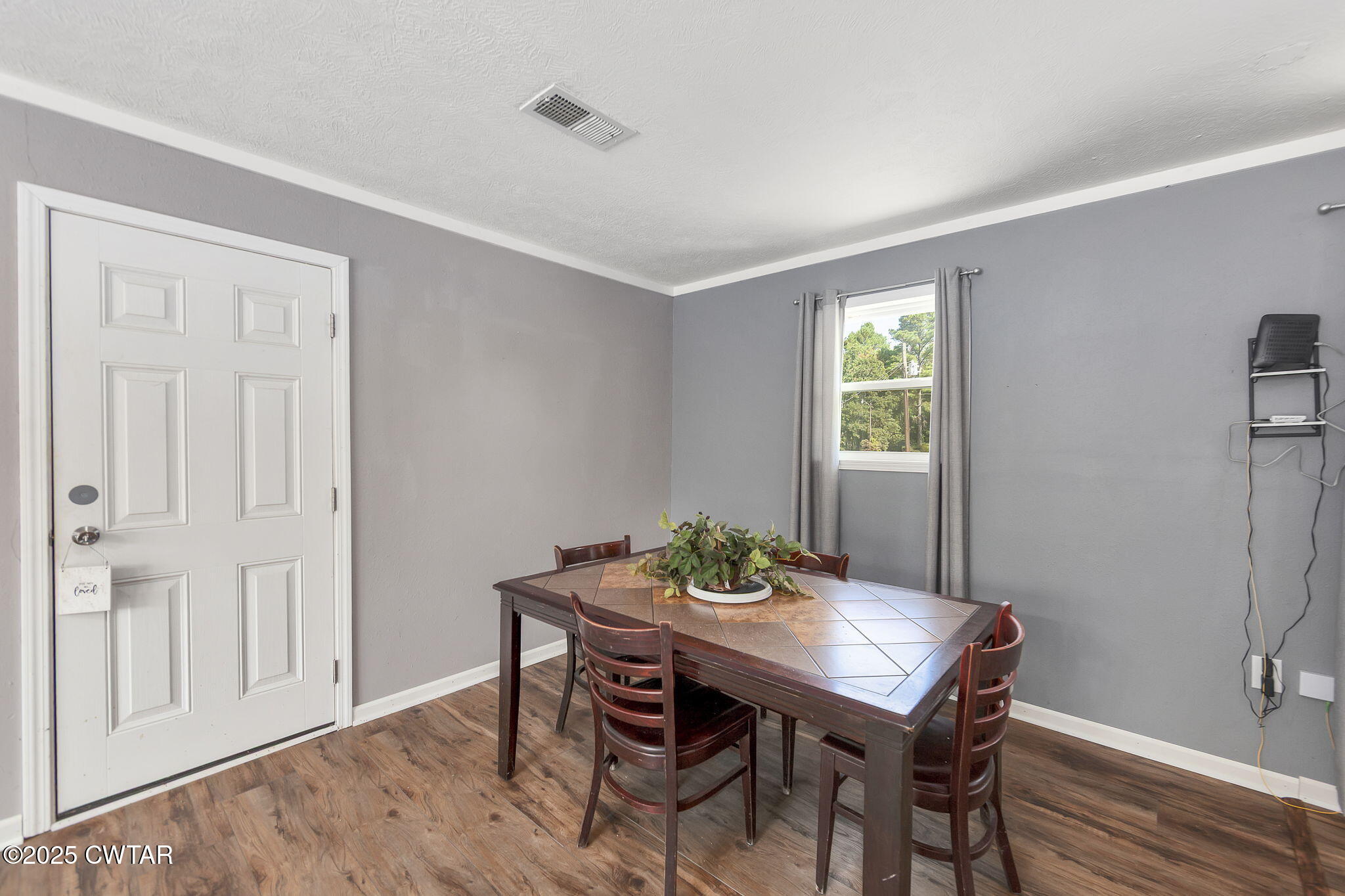 668 Bowman Road Medon, TN 38356 - Photo 13 of 24 a view of a dining room with furniture and wooden floor