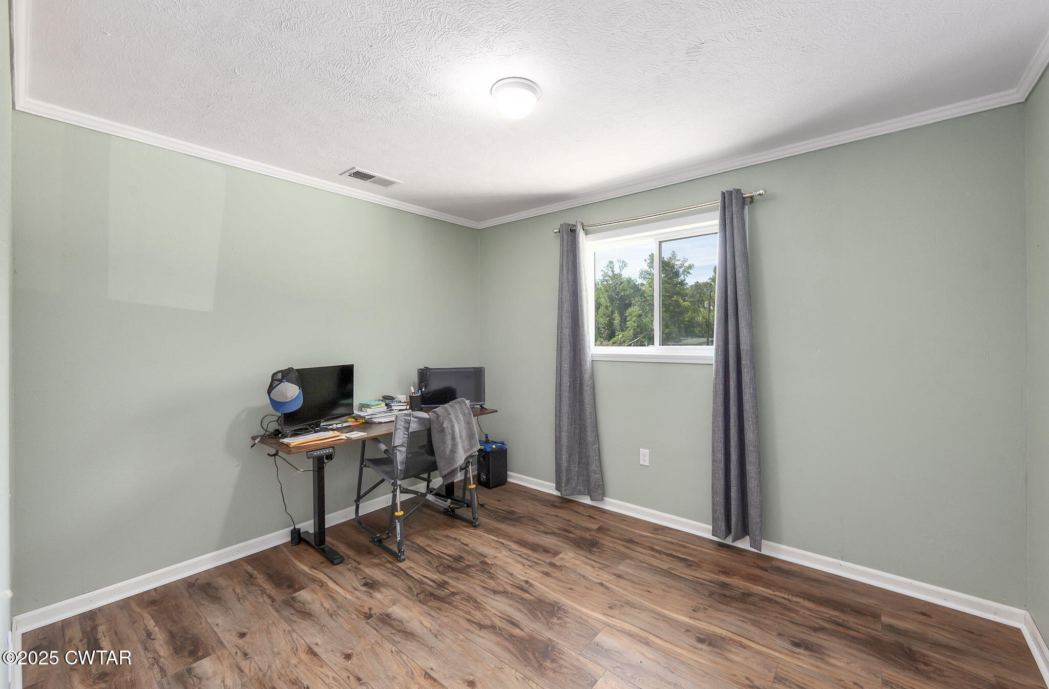 668 Bowman Road Medon, TN 38356 - Photo 18 of 24 a workspace with wooden floor and a window