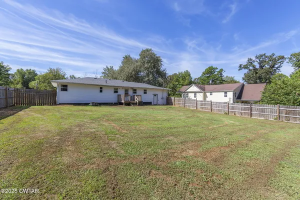a view of a house with a big yard