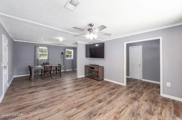 a view of a livingroom with furniture and a fireplace