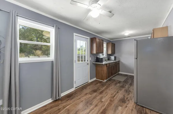 a kitchen with a refrigerator and a sink