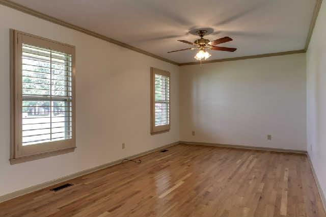 2122 Sulphur Springs Road Murfreesboro, TN 37129 - Photo 3 of 20 HUGE living room with ceiling fan and awesome wood shutter type blinds