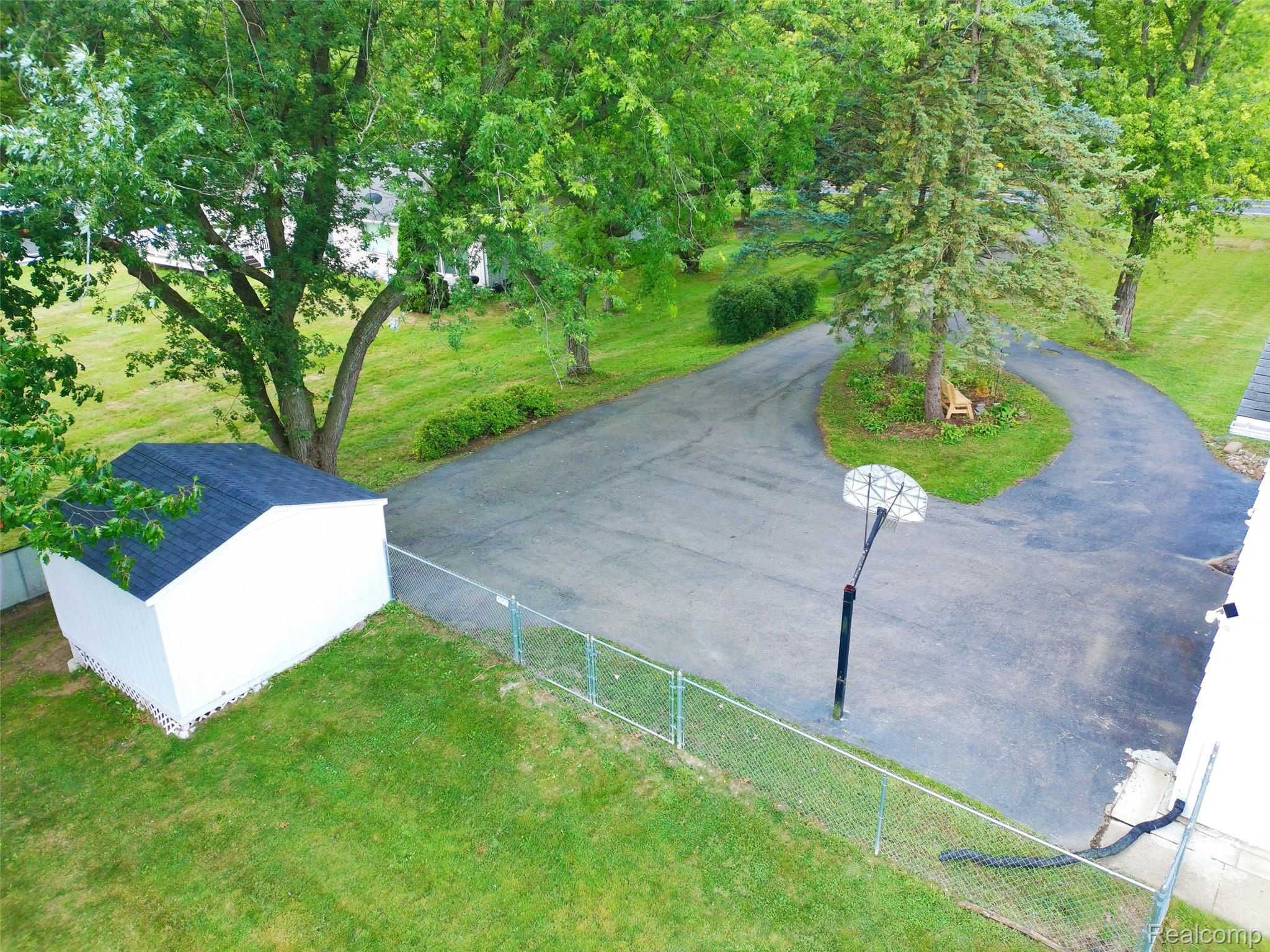 9805 Platt Road Milan, MI 48160 - Photo 40 of 49 46_garage and driveway view drone.jpg