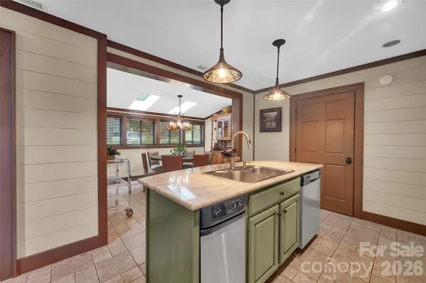 a bathroom with a granite countertop sink a toilet and a mirror