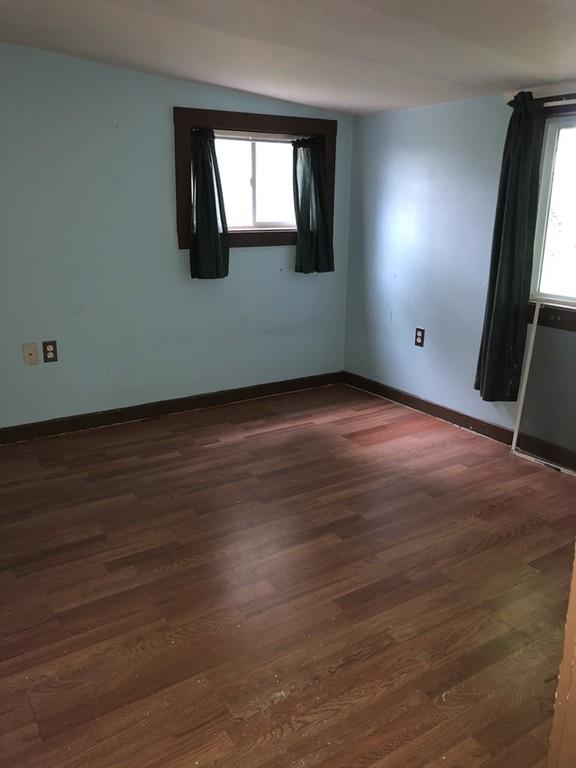 280 Onset Avenue Wareham, MA 02558 - Photo 12 of 15 an empty room with wooden floor and windows