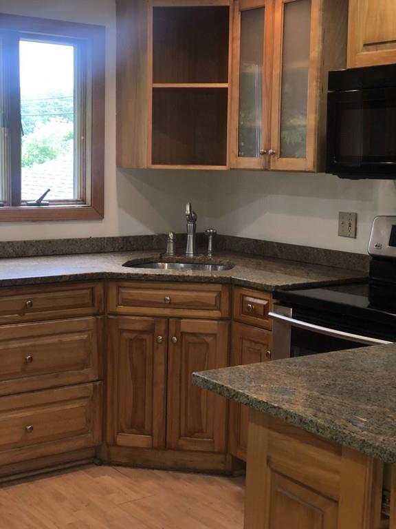 280 Onset Avenue Wareham, MA 02558 - Photo 7 of 15 a kitchen with granite countertop a sink and a stove