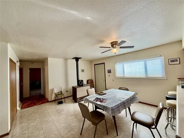 a view of a livingroom with furniture and a table