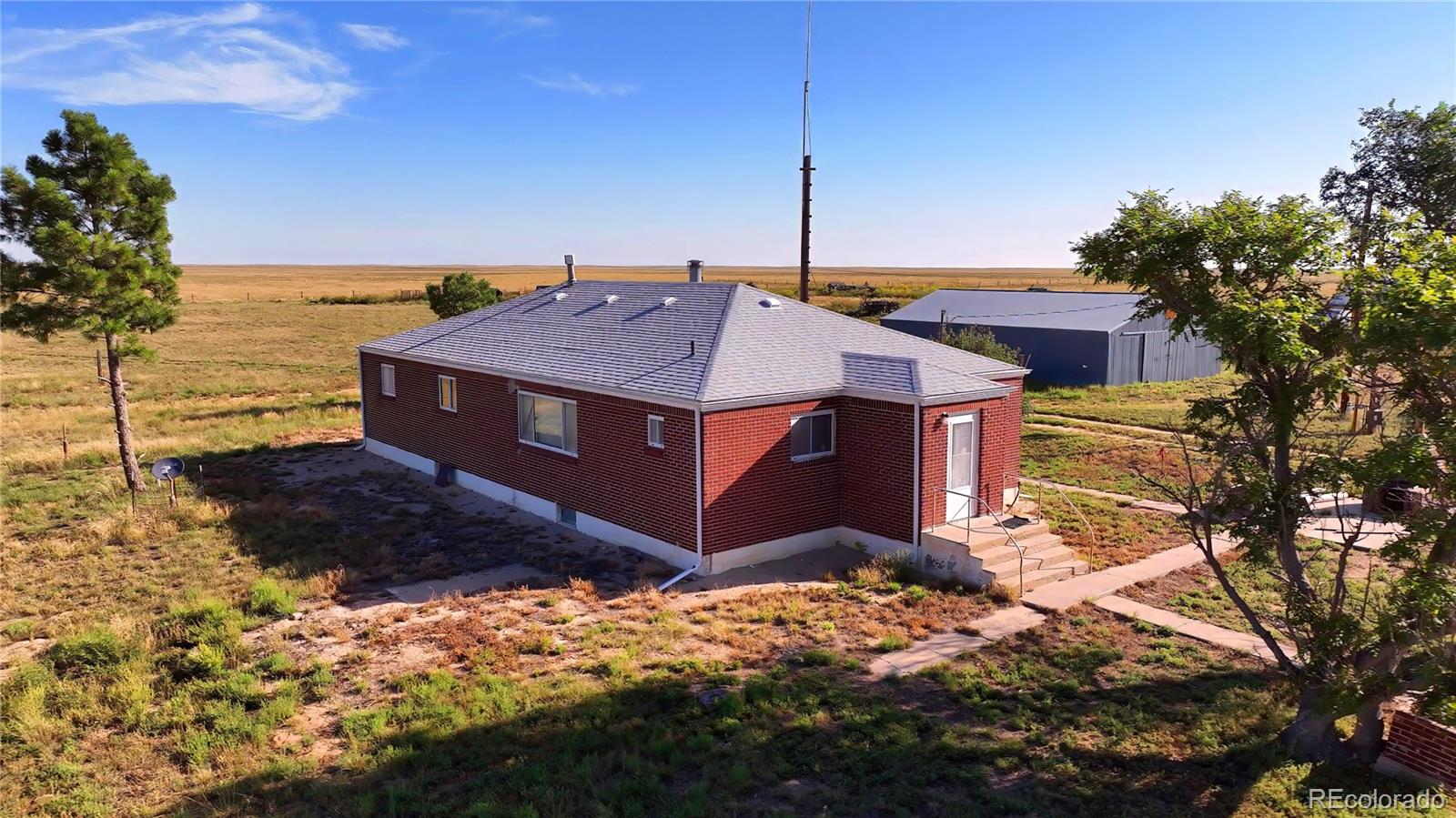 6216 Moreland Road Boone, CO 81025 - Photo 9 of 37 a view of a house with a yard covered with snow